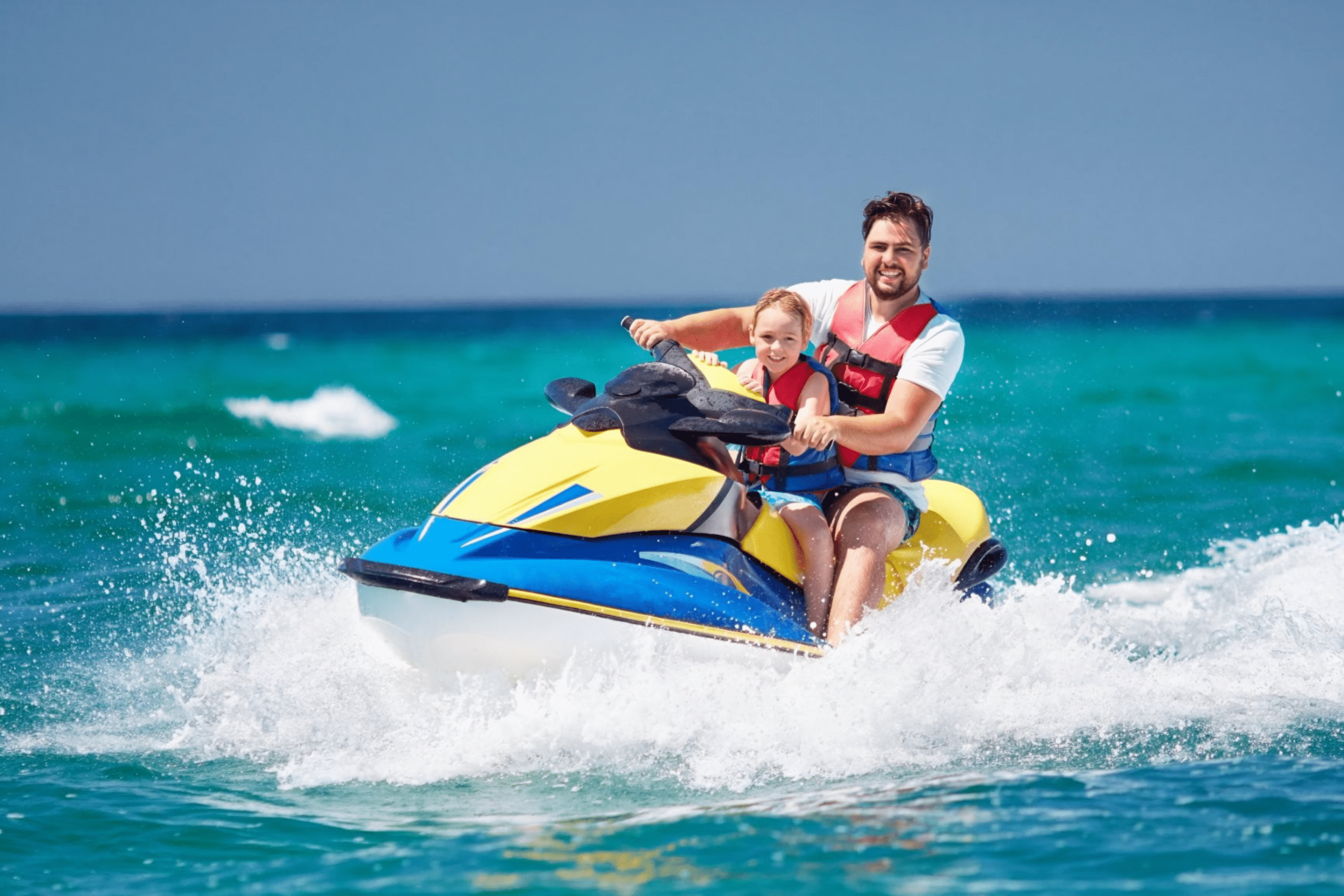 father and son on jet ski, fundraising ideas, charity ideas, silent auction items, travel fundraising events