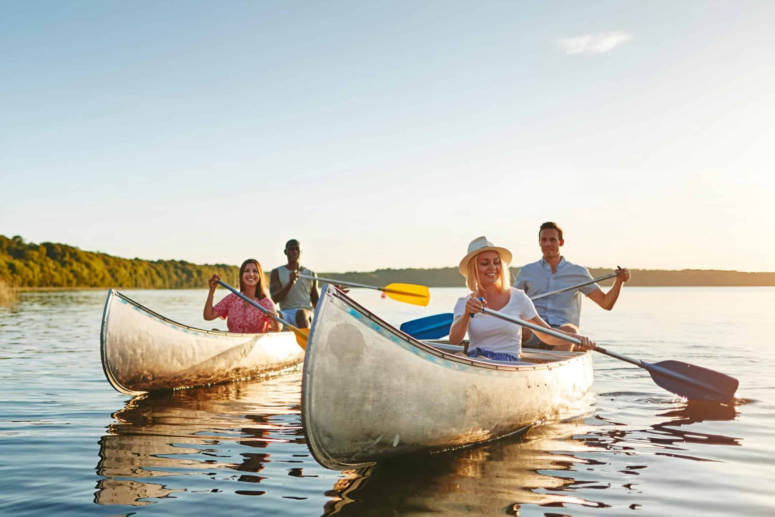 two couples in canoes in lake, fundraising ideas, charity ideas, silent auction items, travel fundraising events