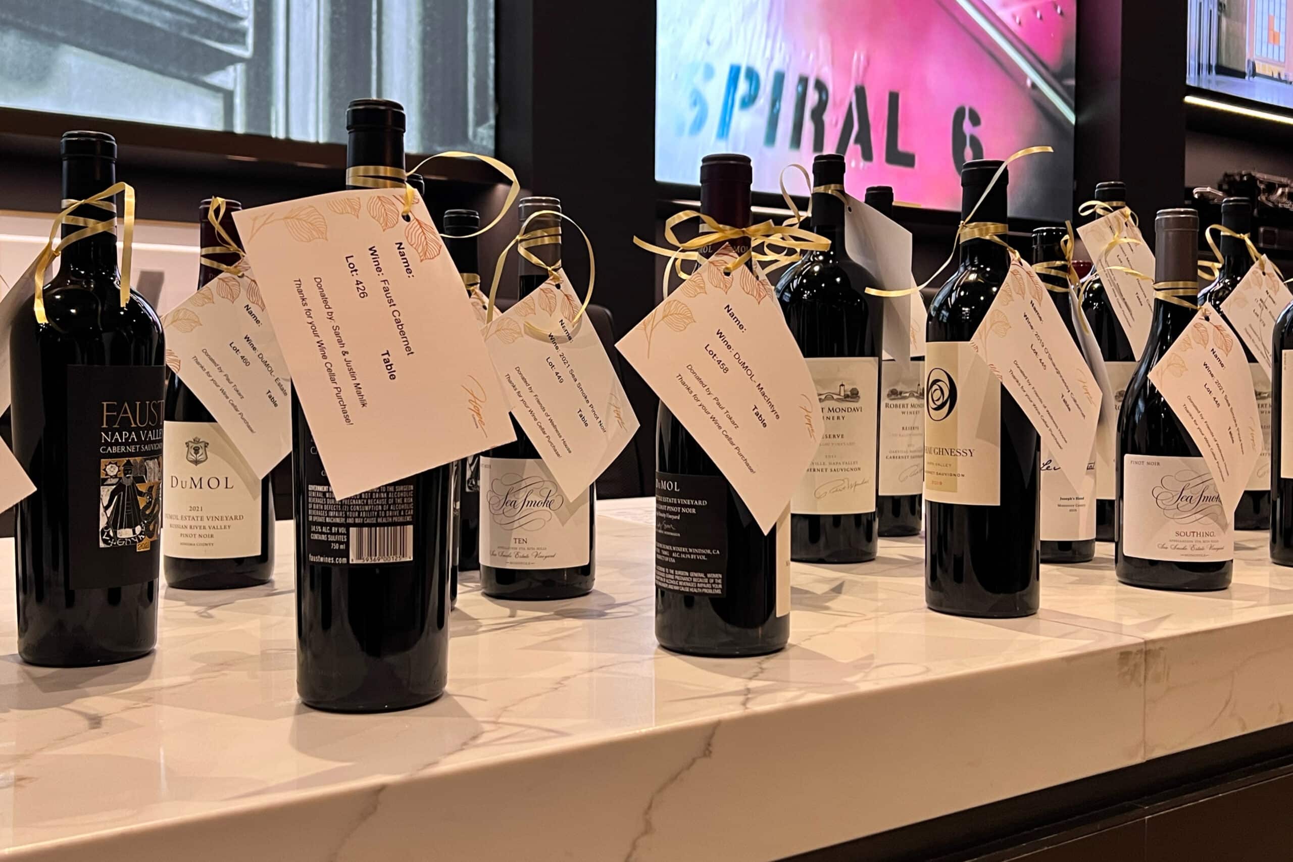 wine bottles on table, vacation fundraising, fundraising ideas, charity ideas, silent auction items, travel fundraising events