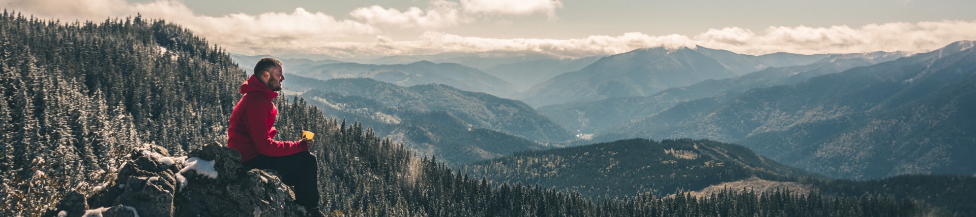 man sitting on top of mountain, Live Auction Fundraising