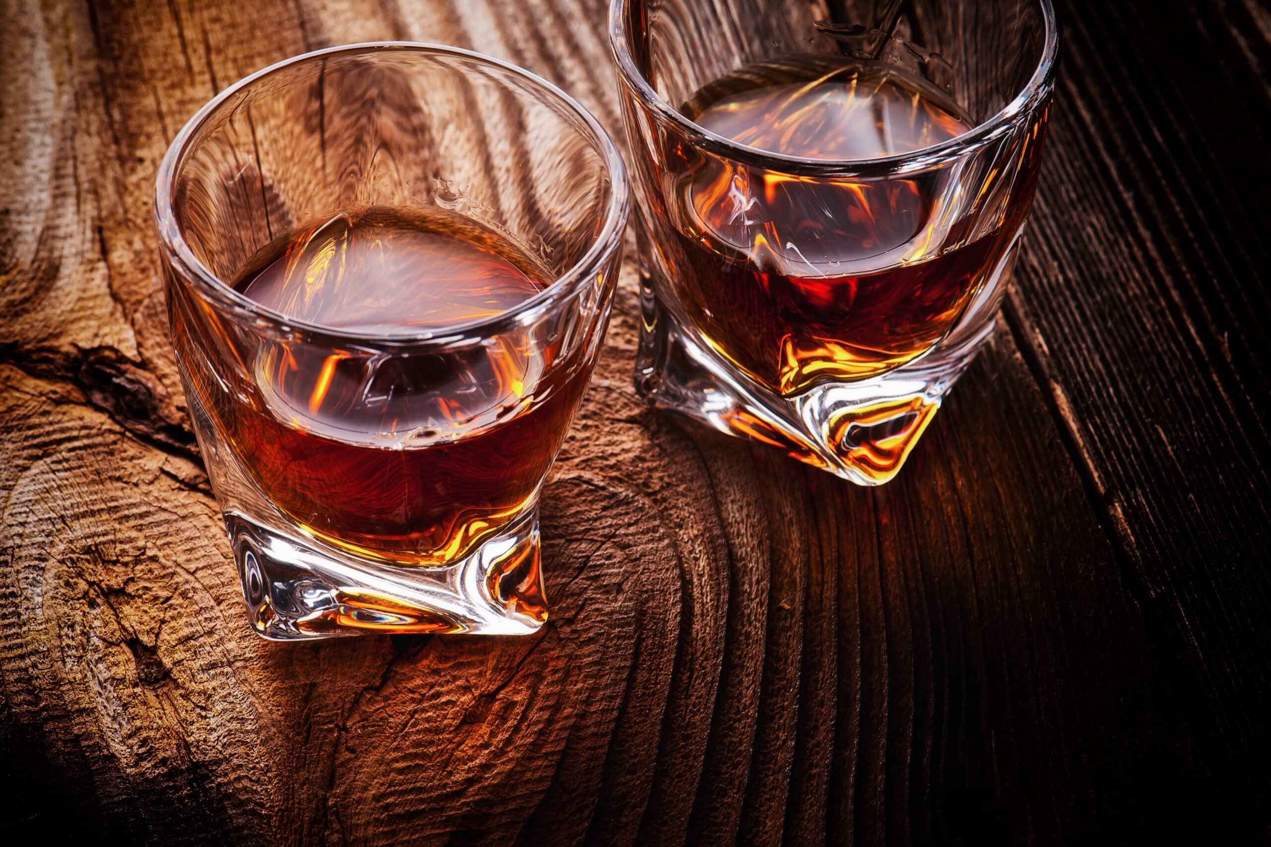 two bourbon glasses on table, charity auction travel packages, vacation fundraising, travel fundraising, fundraising ideas, charity ideas, silent auction items, travel fundraising events