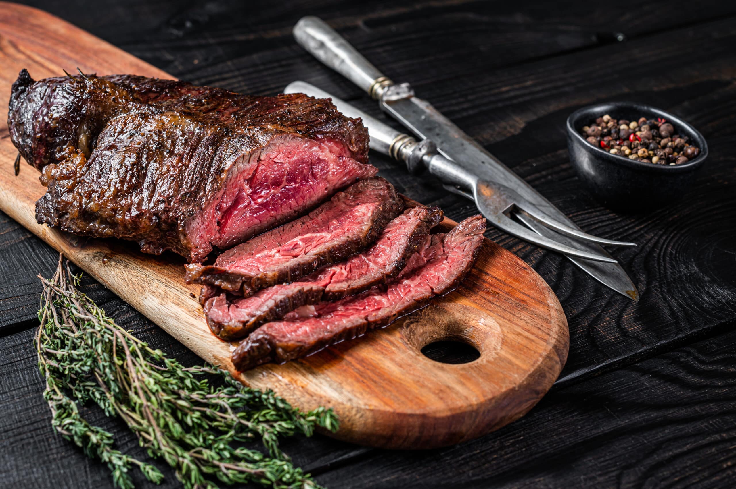 steak sliced on table, charity auction travel packages, vacation fundraising, travel fundraising, fundraising ideas, charity ideas, silent auction items, travel fundraising events