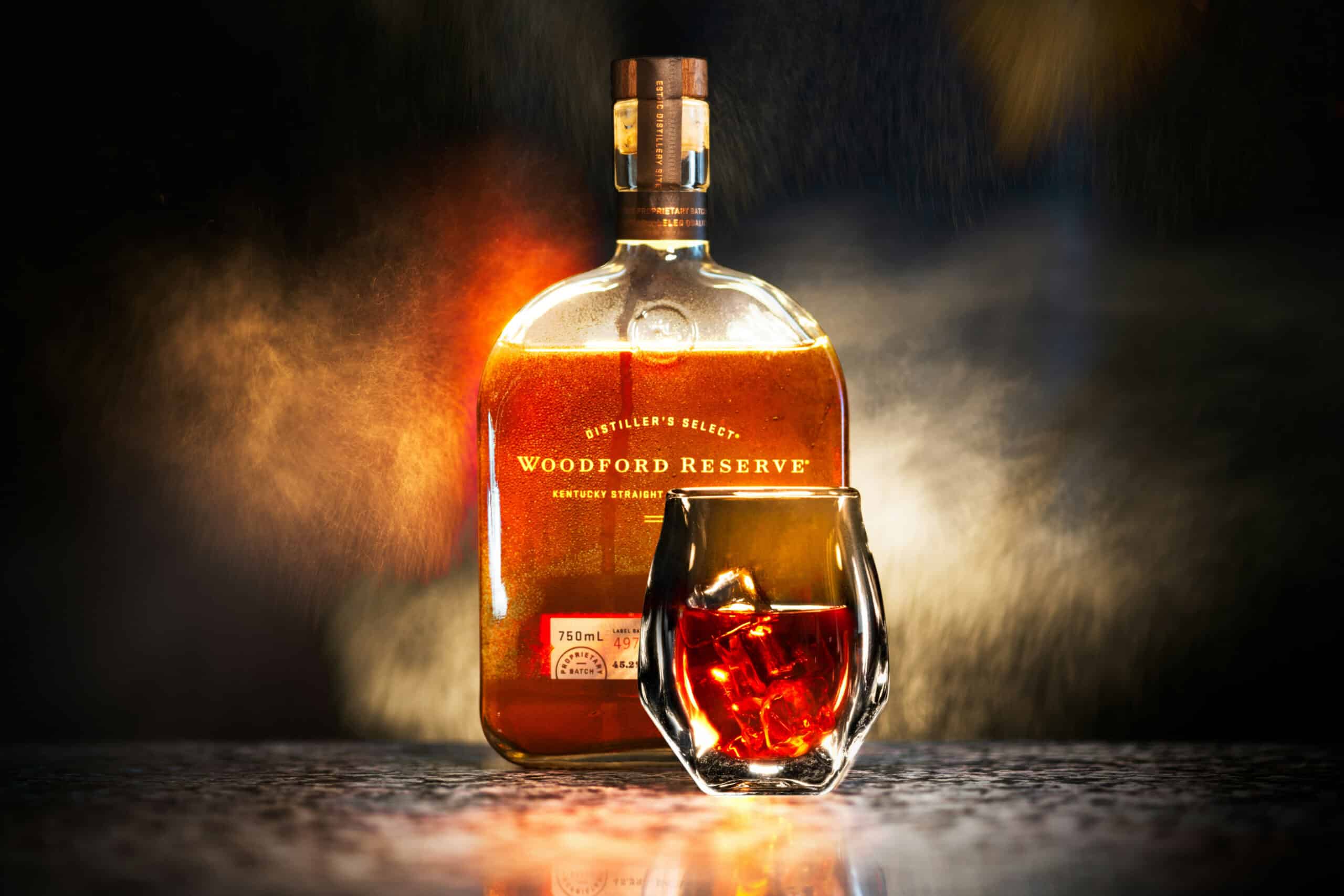 Bourbon bottle and glass on table, charity auction travel packages, vacation fundraising, travel fundraising, fundraising ideas, charity ideas, silent auction items, travel fundraising events