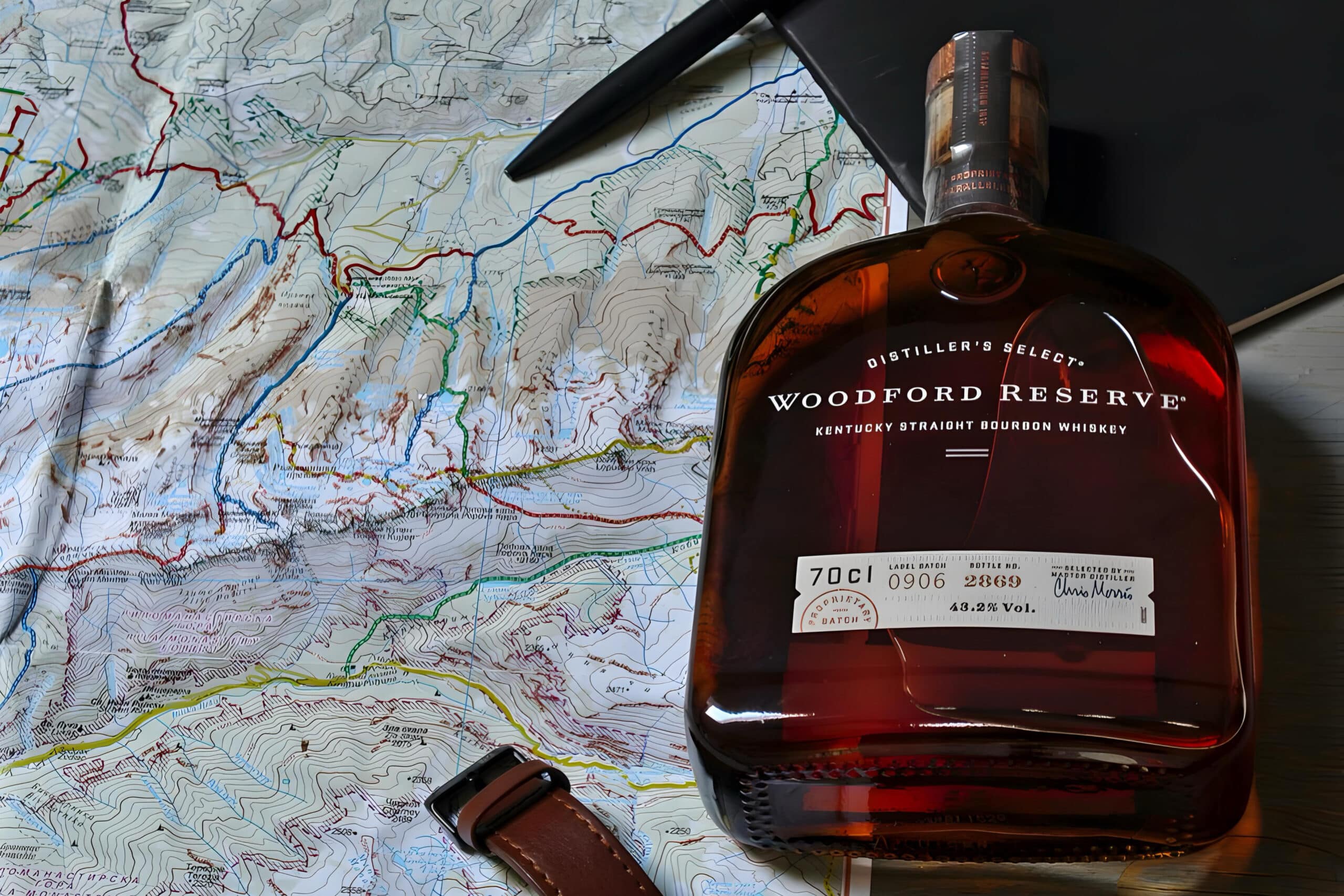 Bottle of whiskey on top of map, charity auction travel packages, vacation fundraising, travel fundraising, fundraising ideas, charity ideas, silent auction items, travel fundraising events