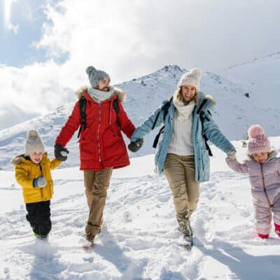 family walking together on snow mountain, charity auction travel packages, vacation fundraising, travel fundraising, fundraising ideas, charity ideas, silent auction items, travel fundraising events