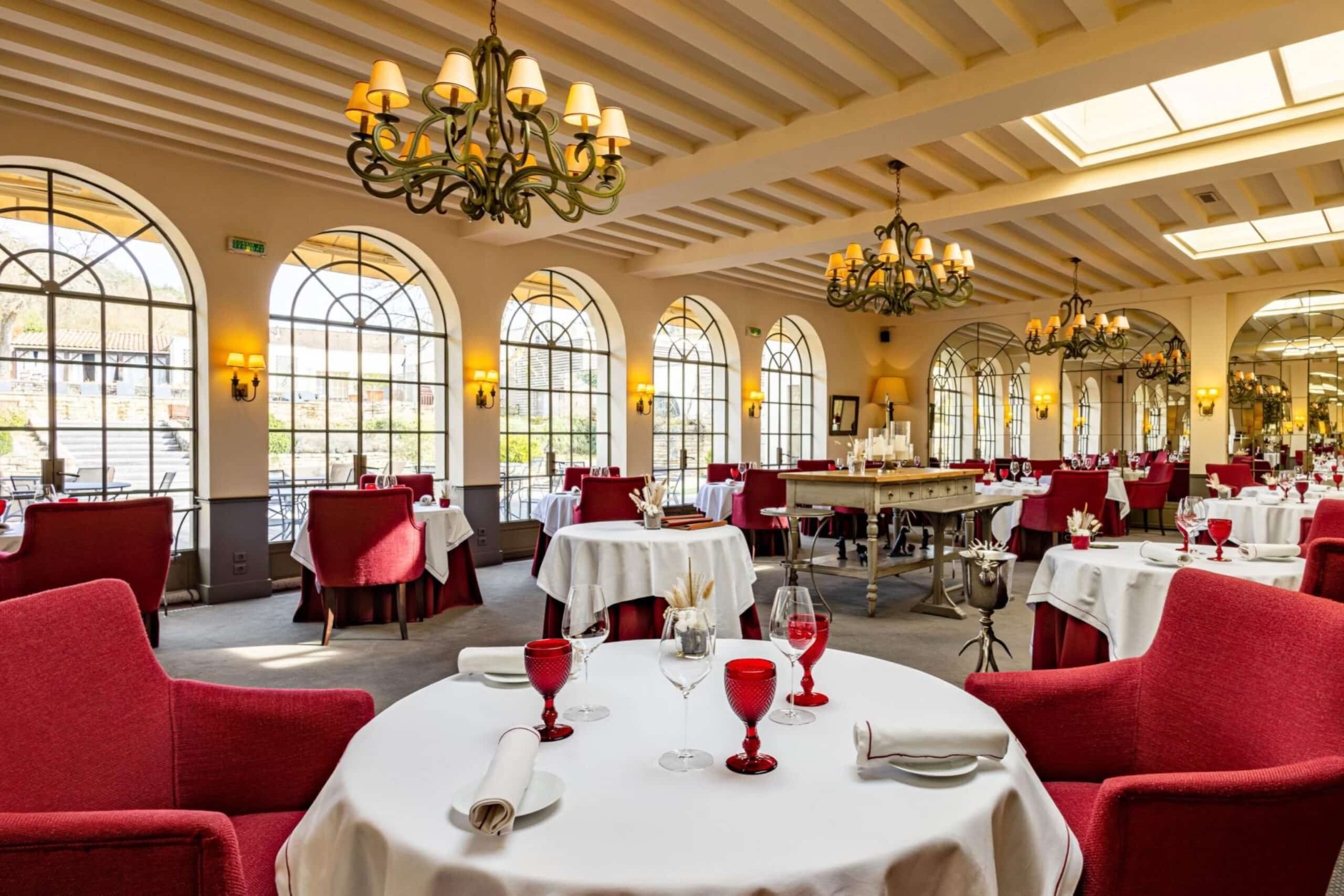 Banquet hall with tables and red chairs, charity auction travel packages, vacation fundraising, travel fundraising, fundraising ideas, charity ideas, silent auction items, travel fundraising events