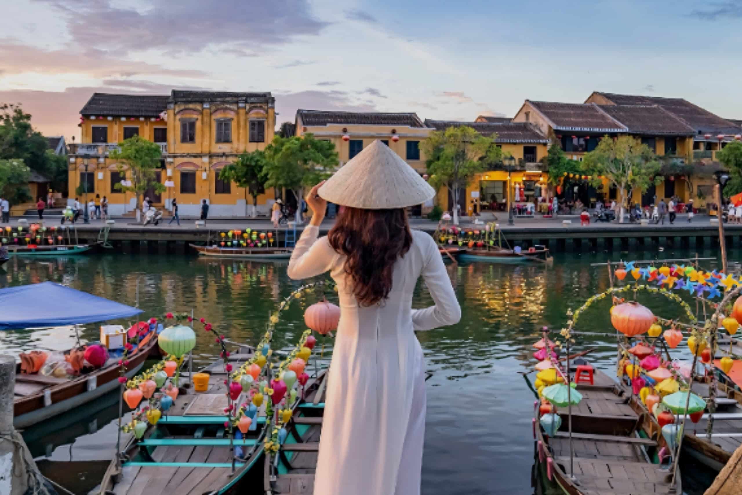 Woman standing and looking at river, charity auction travel packages, vacation fundraising, travel fundraising, fundraising ideas, charity ideas, silent auction items, travel fundraising events