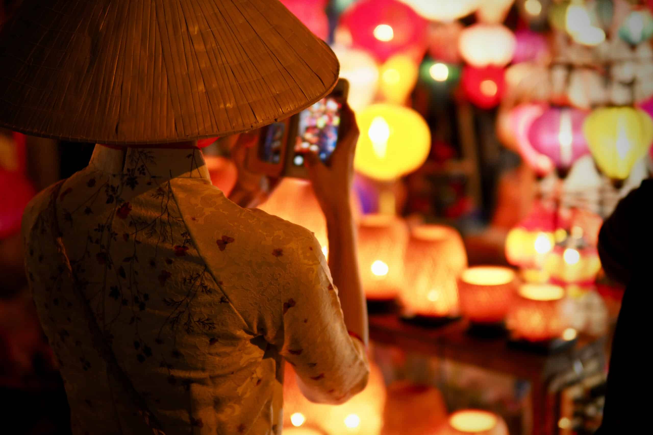 person taking picture in vietnam, charity auction travel packages, vacation fundraising, travel fundraising, fundraising ideas, charity ideas, silent auction items, travel fundraising events