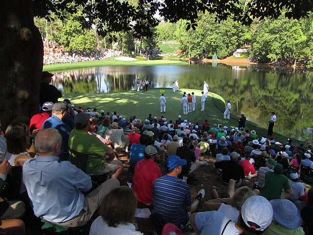 People sitting and watching the Masters golfers, charity auction travel packages, vacation fundraising, travel fundraising, fundraising ideas, charity ideas, silent auction items, travel fundraising events