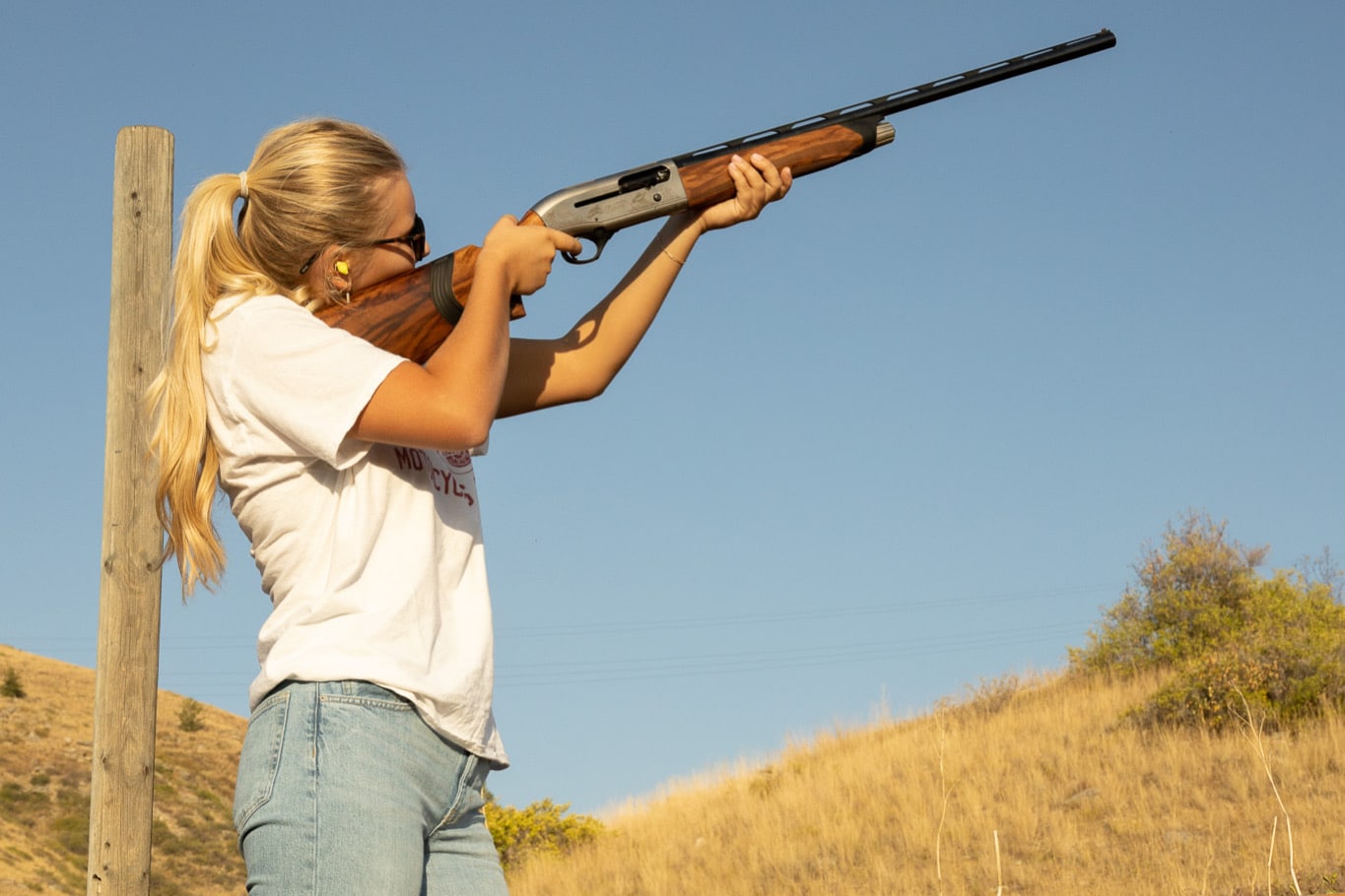 girl shooting shotgun, charity auction travel packages, vacation fundraising, travel fundraising, fundraising ideas, charity ideas, silent auction items, travel fundraising events